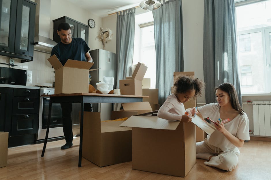 A family unpacks boxes in their new kitchen, enjoying the moving-in process.